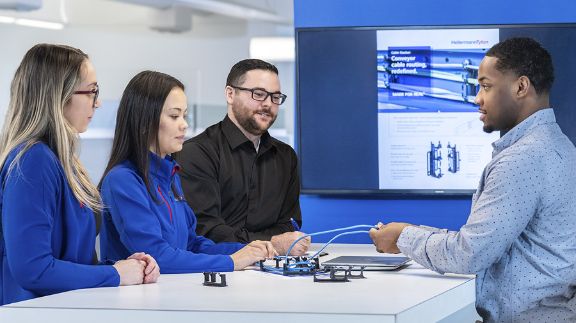 HT employees meeting and collaborating